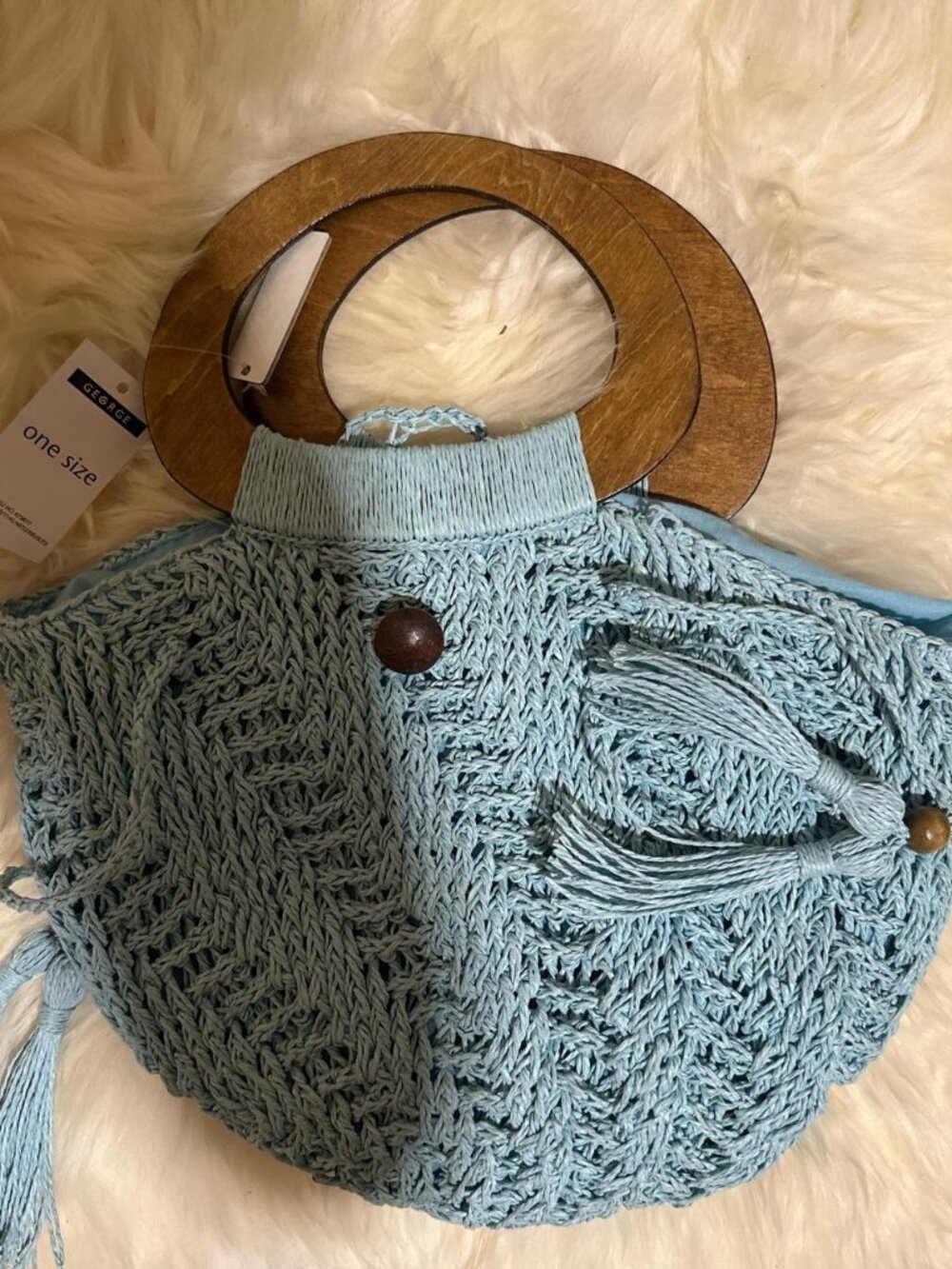 Light blue and tan crochet bag with wooden handle